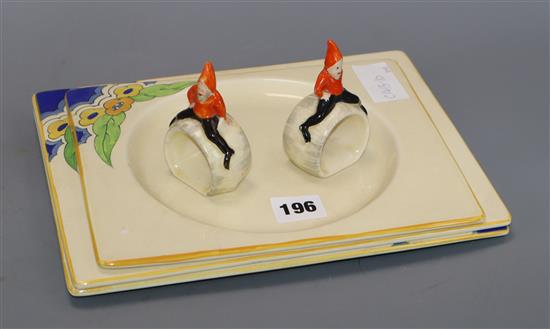 Three Clarice Cliff dishes and similar style napkin rings